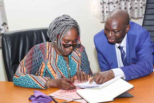 Photo shows Prof. Eunice Omonzejie and Acting VC Prof. Sunday Olowo Samuel during the signing of handing over notes
