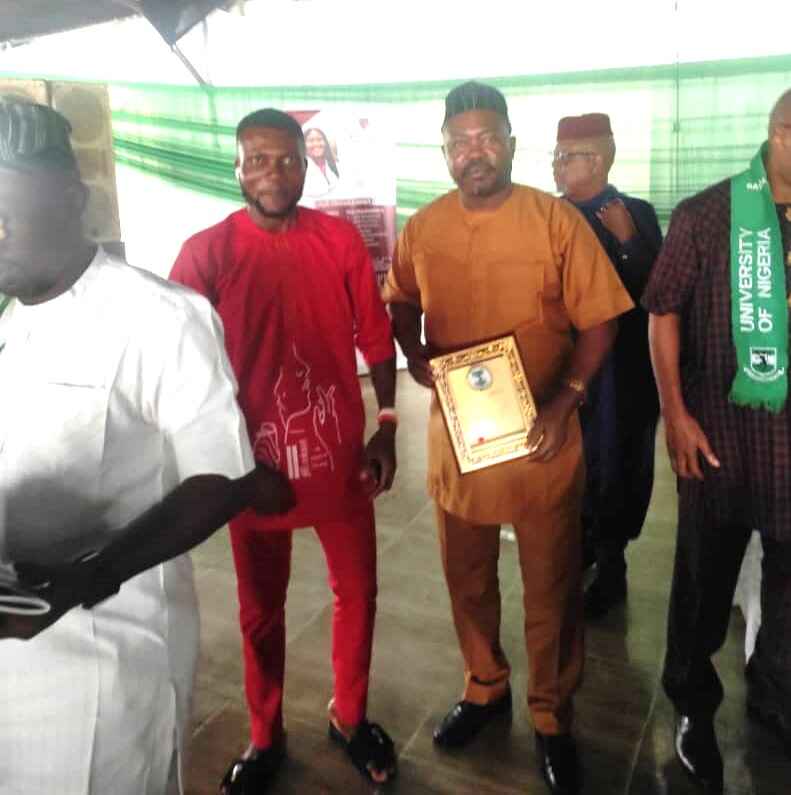 Photo shows a group of people receiving award, including Professor Austin Nosike of James Hope University in Aba